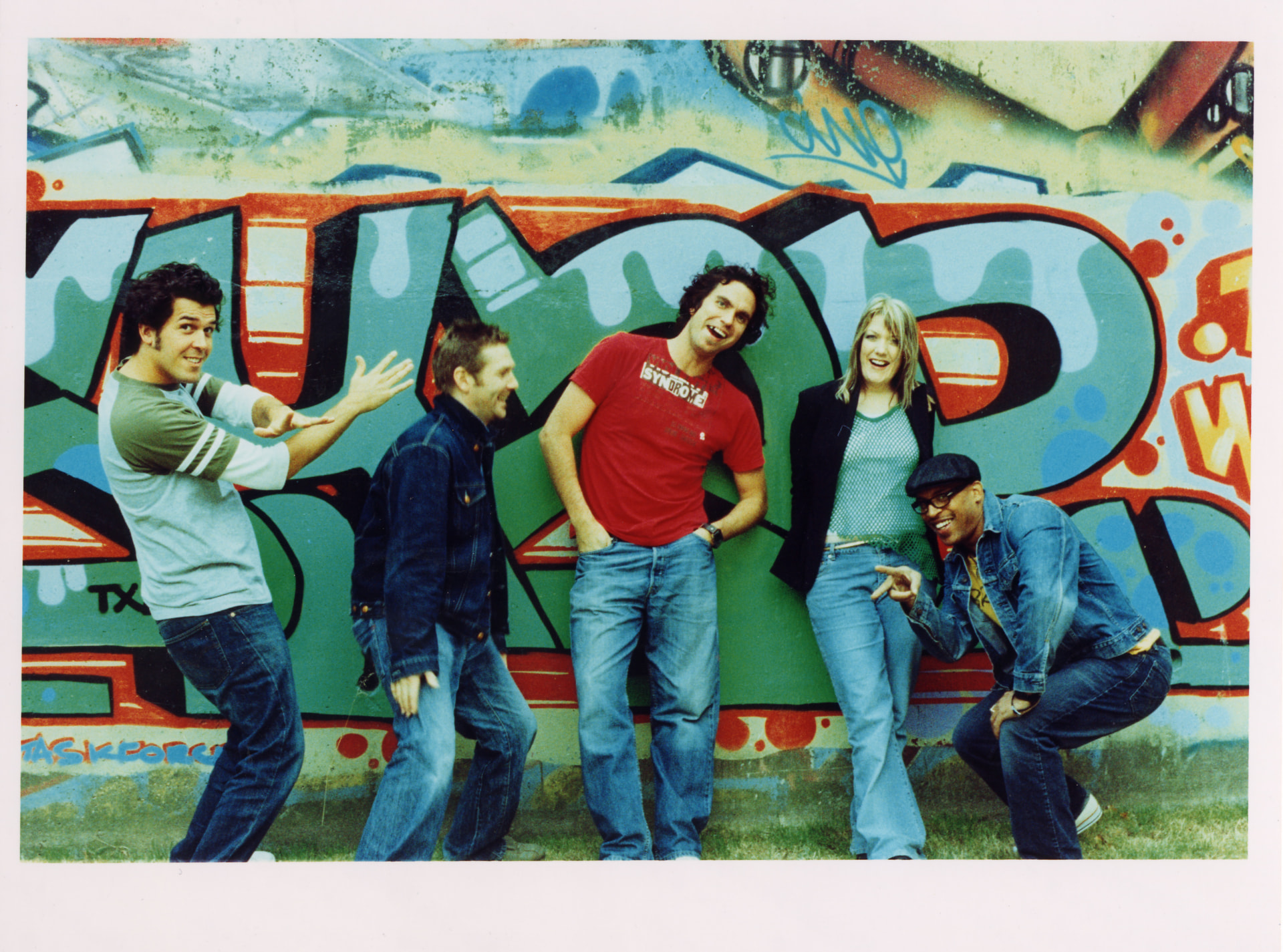 Freaks live band photographed against a graffiti wall